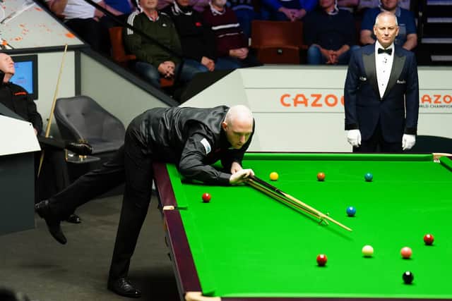 CUE ACTION: Leeds' David Grace, pictured during his match with John Higgins during day four of the World Snooker Championship at Sheffield's Crucible Theatre Picture: Mike Egerton/PA