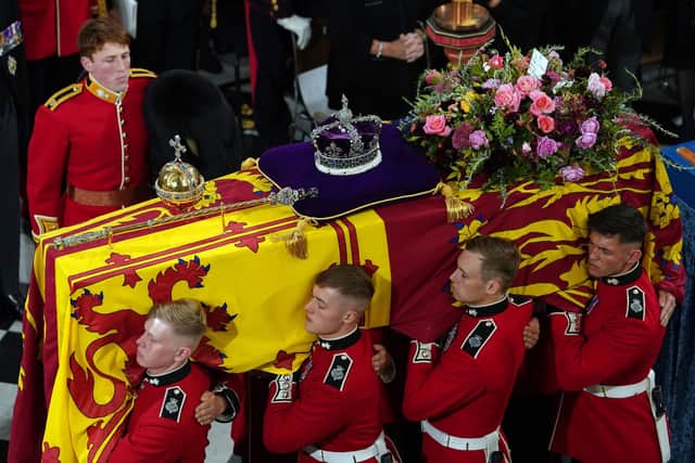 The bearer party with the coffin of Queen Elizabeth II as it is taken from Westminster Abbey, London at the end of service during the State Funeral of the late monarch (Pic: Gareth Fuller/PA Wire)