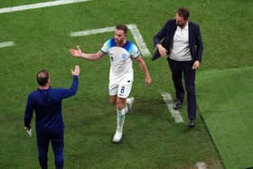 JOB WELL DONE: England's Jordan Henderson with England assistant coach Steve Holland and manager Gareth Southgate after being substituted against Senegale at the Al-Bayt Stadium. Picture: Nick Potts/PA