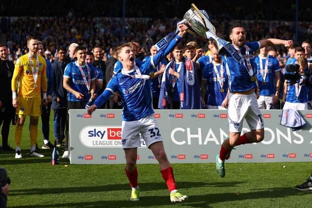 CHAMPION: Joe Rafferty (right) celebrates winning League One with team-mate Paddy Lane