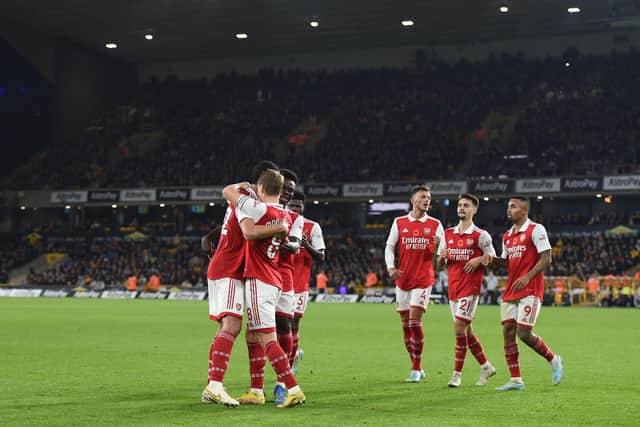 WOLVERHAMPTON, ENGLAND - NOVEMBER 12: Martin Odegaard of Arsenal celebrates with teammates after scoring his team's second goal during the Premier League match between Wolverhampton Wanderers and Arsenal FC at Molineux on November 12, 2022 in Wolverhampton, England. (Photo by Harriet Lander/Getty Images)