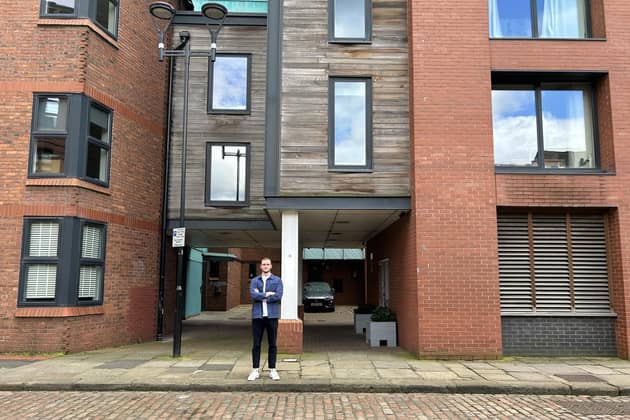 Dan Rutter outside his apartment block at The Chandlers in Leeds
