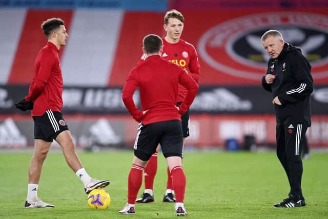 FAMILIAR FACE: Chris Wilder (right) worked with Sander Berge (centre) during the Norwegian midfielder's first year as a Sheffield United player