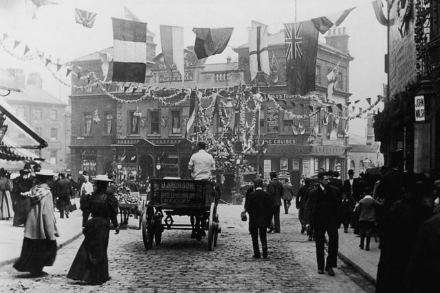 Flags and bunting decorations hung up in Sheffield marketplace in 1905.