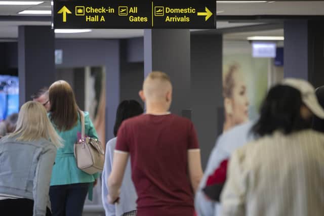 Passengers at Leeds Bradford Airport, which has been named the UK's worst airport for security queues. (Photo credit: Danny Lawson/PA Wire)