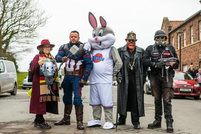 Fans of the event dressed in character outside York Racecourse.