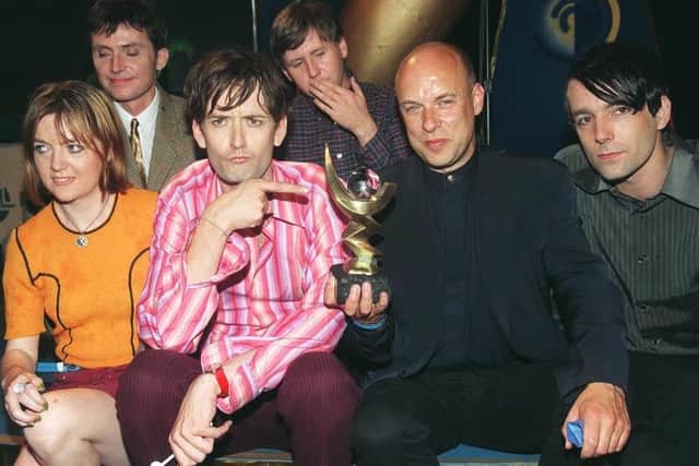 Pulp frontman Jarvis Cocker points at the 1996 Mercury Music Prize, awarded for their album Different Class. Picture: Stefan Rousseau/PA.