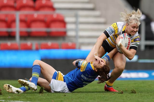 TOP MARKS: York City Knights' Tara Jane Stanley in action with Leeds Rhinos' Courtney Winfield-Hill. Picture by John Clifton/SWpix.com