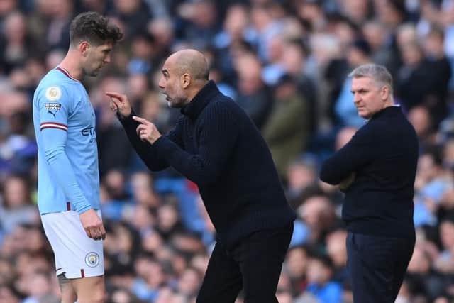 ONLY HUMAN: Paul Heckingbottom has told his Sheffield United players not to lose perspective of the threat posed by Manchester City manager Pep Guardiola (centre) and players like Barnsley-born defender John Stones (right)