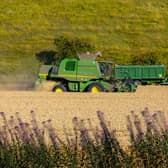 Farmers harvesting the wheat in fields last summer in the Yorkshire Wolds. PIC: Tony Johnson
