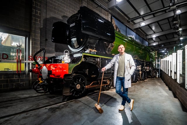 Joshua Chapman, from the  National Railway Museum York, making sure the area around this special train is clean in readiness for its view to the public on Saturday 1st April.