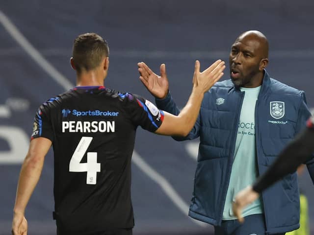 Huddersfield Town manager Darren Moore shakes hands with Matty Pearson after the Sky Bet Championship match at the Coventry Building Society Arena, Coventry. Picture date: Monday September 25, 2023. PA Photo. See PA story SOCCER Coventry. Photo credit should read: Nigel French/PA Wire.

RESTRICTIONS: EDITORIAL USE ONLY No use with unauthorised audio, video, data, fixture lists, club/league logos or "live" services. Online in-match use limited to 120 images, no video emulation. No use in betting, games or single club/league/player publications.