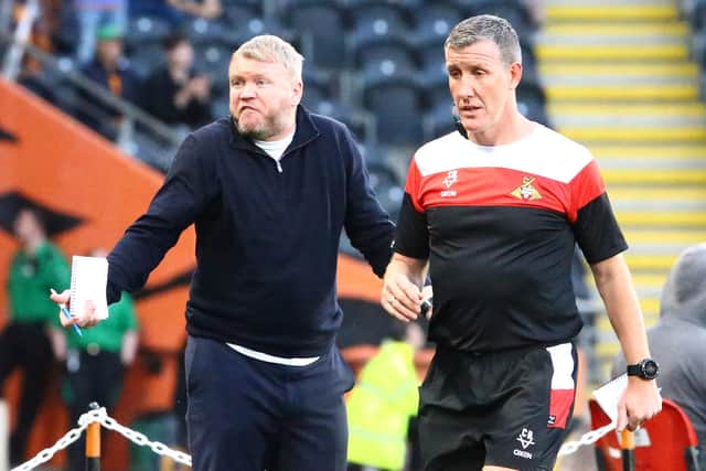 DELIGHTED: Doncaster Rovers manager Grant McCann with his assistant Cliff Byrne (right)