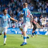 Duane Holmes, pictured celebrating with Danny Ward after netting in Huddersfield Town's win over Stoke City last August. The midfielder has now joined Championship rivals Preston North End.