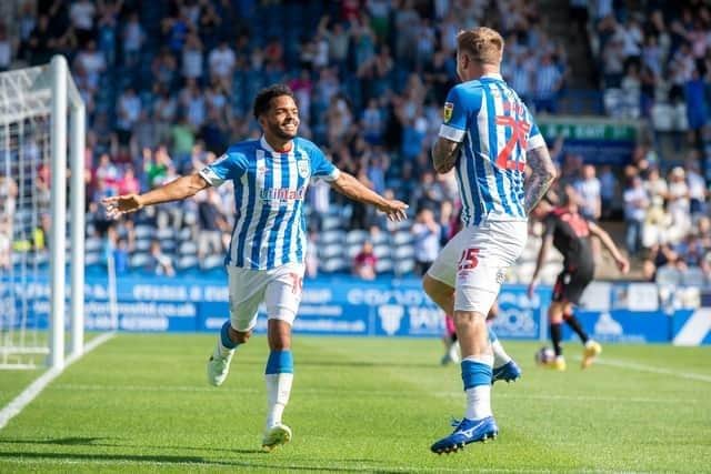 Duane Holmes, pictured celebrating with Danny Ward after netting in Huddersfield Town's win over Stoke City last August. The midfielder has now joined Championship rivals Preston North End.
