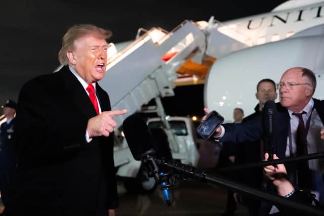 President Donald Trump speaks with reporters as he arrives on Air Force One at Joint Base Andrews. PIC: AP Photo/Alex Brandon