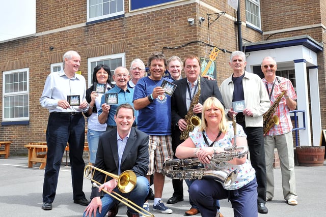 Tenant of The Park In Rick Hanlon (centre) and Mick Donnelly with fellow members of Musicians Unlimited. They were celebrating after raising £12,000 through their sponsored album 10 years ago.