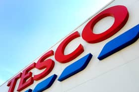 File photo of a Tesco shop sign, as the supermarket giant said it will shake-up its shop management roles and shut remaining counters and hot delis in an overhaul which will impact around 2,100 jobs.