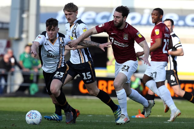 John-Joe O'Toole of Northampton Town contests the ball with Mitchell Clark of Port Vale during the Sky Bet League Two match between Northampton Town and Port Vale at PTS Academy Stadium on March 30, 2019.
