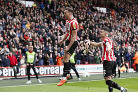 Sheffield United's Jack Robinson (centre) celebrates scoring their side's second goal of the game during the Sky Bet Championship match at Bramall Lane, Sheffield. Picture date: Saturday April 15, 2023. PA Photo. See PA story SOCCER Sheff Utd. Photo credit should read: Richard Sellers/PA Wire.RESTRICTIONS: EDITORIAL USE ONLY No use with unauthorised audio, video, data, fixture lists, club/league logos or "live" services. Online in-match use limited to 120 images, no video emulation. No use in betting, games or single club/league/player publications.