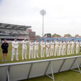 United in tribute: The players of Yorkshire and Glamorgan, the coaches and umpires, line up for a minute's silence in memory of Josh Baker prior to the County Championship match at Headingley on Friday. Picture: Dave Williams cricketphotos.co.uk