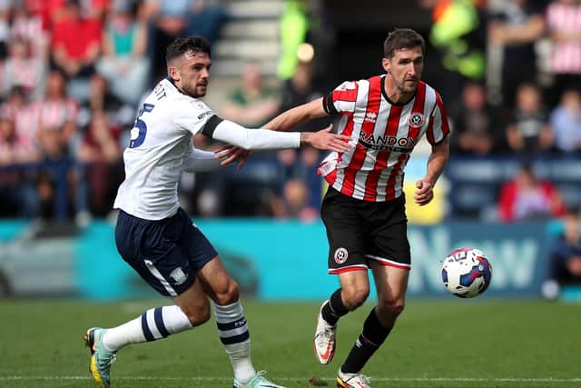 Preston North End's Troy Parrott pulls back on Sheffield United's Chris Basham during the Sky Bet Championship match at Deepdale on Saturday. Picture: Isaac Parkin/PA Wire.