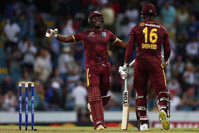 OVER THE LINE: Matthew Forde and Romario Shepherd celebrate victory for West Indies over England in the during the third ODI match, held at the Kensington Oval, Barbados. Picture: Ashley Allen/Getty Images.