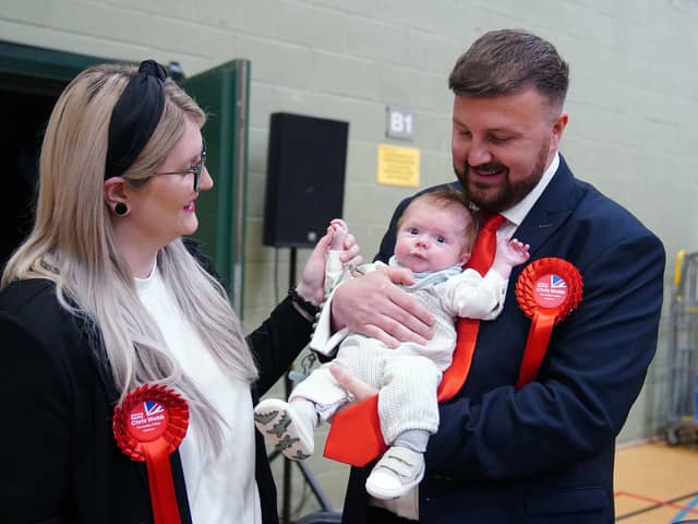 Labour candidate Chris Webb celebrates with his wife Portia and baby Cillian Douglas Webb after winning the Blackpool South by-election following the count at Blackpool Sports Centre, Blackpool. The by-election was triggered after the resignation of Scott Benton. Picture date: Friday May 3, 2024.