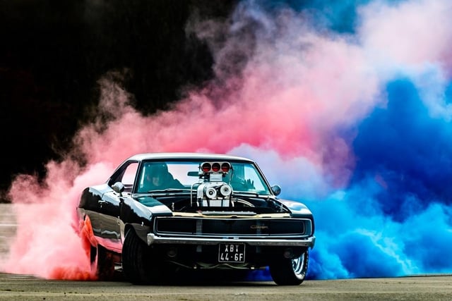 Will Formosa, of London, entertaining the crowds with a coloured burn-out in his 1968 Dodge Charger, with a Supercharged Big Block.