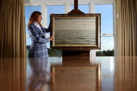 Charlotte Conboy, Head of Pictures at Tennants Auctioneers. is pictured with the The North Sea, an important seascape by Laurence Stephen Lowry, at Tennants Auctioneers, Leyburn