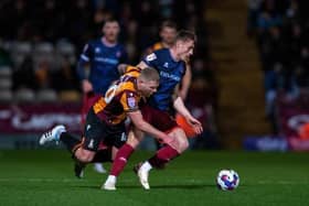 Bradford City midfielder Adam Clayton is blocked by Carlisle United rival Owen Moxon in the league fixture between these sides in March. Picture: Bruce Rollinson