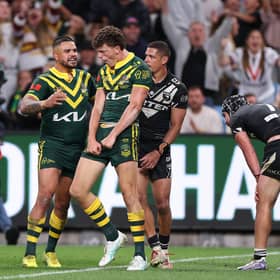 Debutant Jack Bostock, centre, with Australia's hat-trick hero. (Photo: Cameron Spencer/Getty Images)
