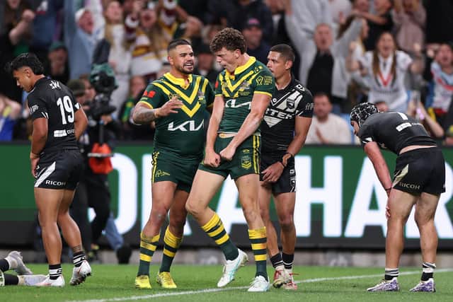 Debutant Jack Bostock, centre, with Australia's hat-trick hero. (Photo: Cameron Spencer/Getty Images)