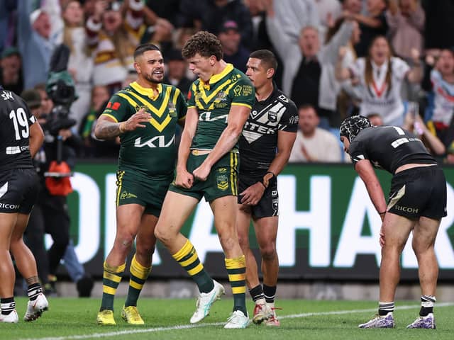 Debutant Jack Bostock, centre, with Australia's hat-trick hero. (Photo: Cameron Spencer/Getty Images)