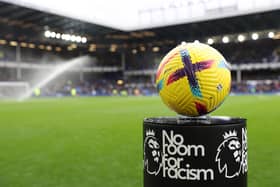 LIVERPOOL, ENGLAND - FEBRUARY 18: A detailed view of the Nike Flight Hi-Vis Premier League match ball on the 'No Room For Racism' plinth prior to the Premier League match between Everton FC and Leeds United at Goodison Park on February 18, 2023 in Liverpool, England. (Photo by Clive Brunskill/Getty Images)