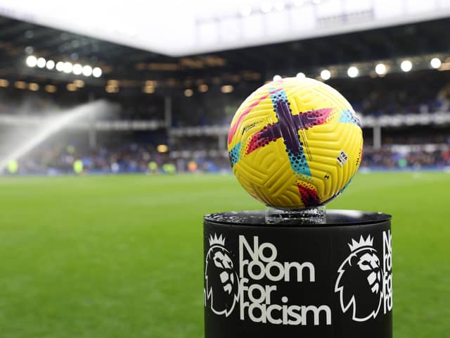 LIVERPOOL, ENGLAND - FEBRUARY 18: A detailed view of the Nike Flight Hi-Vis Premier League match ball on the 'No Room For Racism' plinth prior to the Premier League match between Everton FC and Leeds United at Goodison Park on February 18, 2023 in Liverpool, England. (Photo by Clive Brunskill/Getty Images)