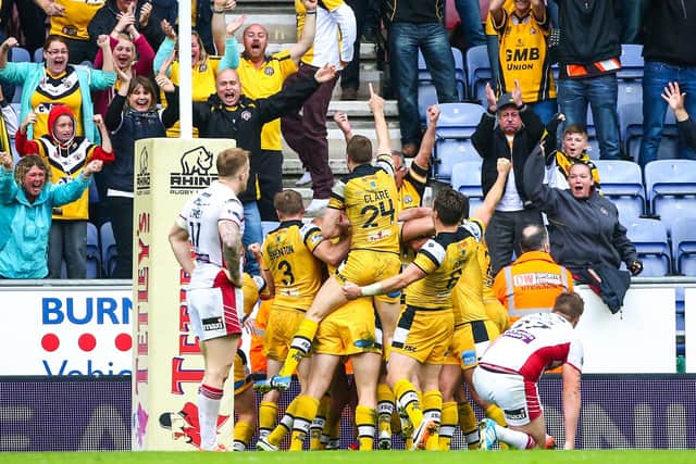 Lee Jewitt is mobbed after scoring a memorable try. (Photo: Alex Whitehead/SWpix.com)