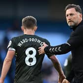 Southampton's Austrian manager Ralph Hasenhuttl congratulates Southampton's English midfielder James Ward-Prowse after the English Premier League football match between Manchester City and Southampton at the Etihad Stadium in Manchester, north west England, on October 8, 2022. (Photo by OLI SCARFF/AFP via Getty Images)