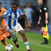 Huddersfield Town midfielder Alex Matos gets away from Hull City's Jaden Philogene in the recent Championship game at the John Smith's Stadium. Picture: Jonathan Gawthorpe