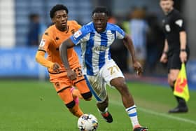 Huddersfield Town midfielder Alex Matos gets away from Hull City's Jaden Philogene in the recent Championship game at the John Smith's Stadium. Picture: Jonathan Gawthorpe