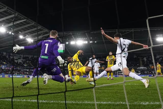 Rotherham United's Chiedozie Ogbene scores their side's first goal of the game during the Sky Bet Championship match at the Swansea.com Stadium, Swansea. Picture: Nich Potts/PA