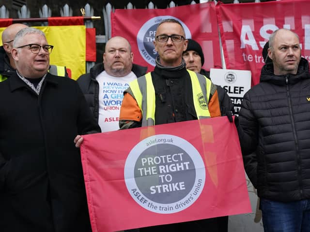 Train drivers from the Aslef union on the picket line at Waterloo station in London