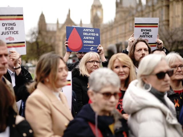 Infected blood victims and campaigners protest on College Green in Westminster. PIC: Aaron Chown/PA Wire
