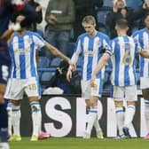 Huddersfield Town's Delano Burgzorg (right) celebrates with team-mates after scoring the opener during the Sky Bet Championship match against West Brom. Picture: Richard Sellers/PA Wire.