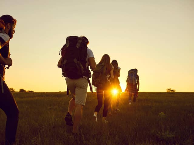 A group of friends hiking with heavy rucksacks. Picture: Alamy/P