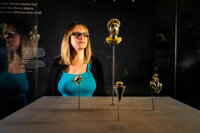 Rebecca Griffiths, the FLO, Finds Liaison Officer with the Portable Antiquities Scheme, looking at the Yorkshire Hoard which consists of a small bronze bust of Antonine emperor Marcus Aurelius, The knife handle in the form of a horse, may symbolically represent a sacrificial animal in this context, The plumb bob is a large and fine example of a functional object used in Roman engineering projects, and a beautifully detailed horse and rider figure, a localised depiction of the god Mars, is of a type that has never been found this far north. Picture By Yorkshire Post Photographer,  James Hardisty.