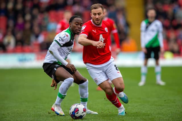 Herbie Kane goes past Jay Matete in Barnsley's League One game against Plymouth Argyle in March. Picture: Bruce Rollinson.