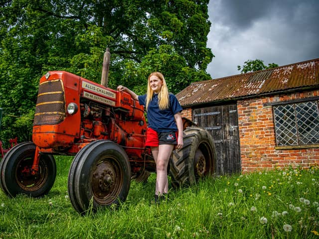 Tractor enthusiast Charlotte Wilson from Northallerton with her vintage Allis Chalmers tractor she is restoring with the help of her father, Colin, photographed by Tony Johnson for The Yorkshire Post.