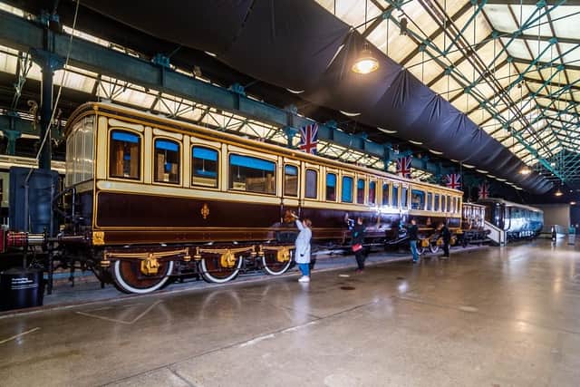 A team at the National Railway Museum, York, clean the six royal carriages on permanent display in Station Hall. (Pic credit: James Hardisty)