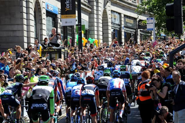 Crowds line the Headrow at the start at the first stage of the Tour de France in Leeds in 2014. PIC: Bruce Rollinson